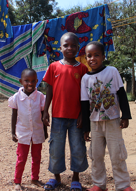 kids hanging out laundry drying on line