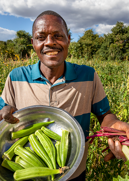 man holds okra
